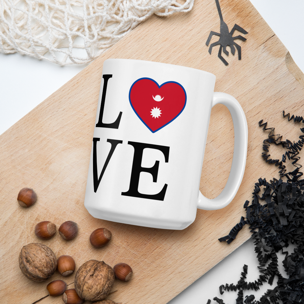 White mug with I love Nepal coffee mug design featuring a heart with Nepal flag on wood background