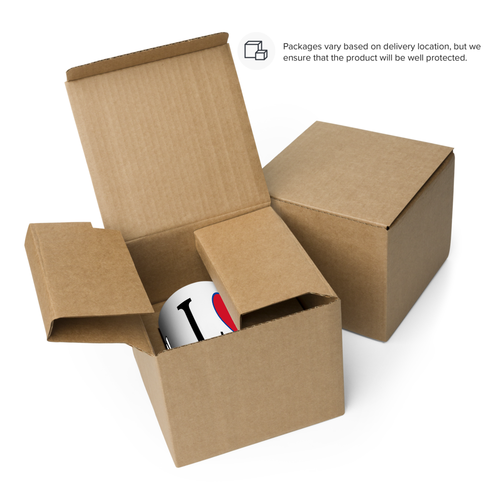 I love Nepal coffee mug partially visible inside open protective brown cardboard shipping box