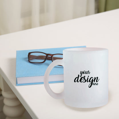 Customizable frosted mugs by lilmonal with space for your design on a white table next to a blue book and glasses