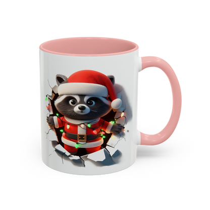 Holiday raccoon coffee cup with pink handle featuring raccoon in Santa outfit holding Christmas lights