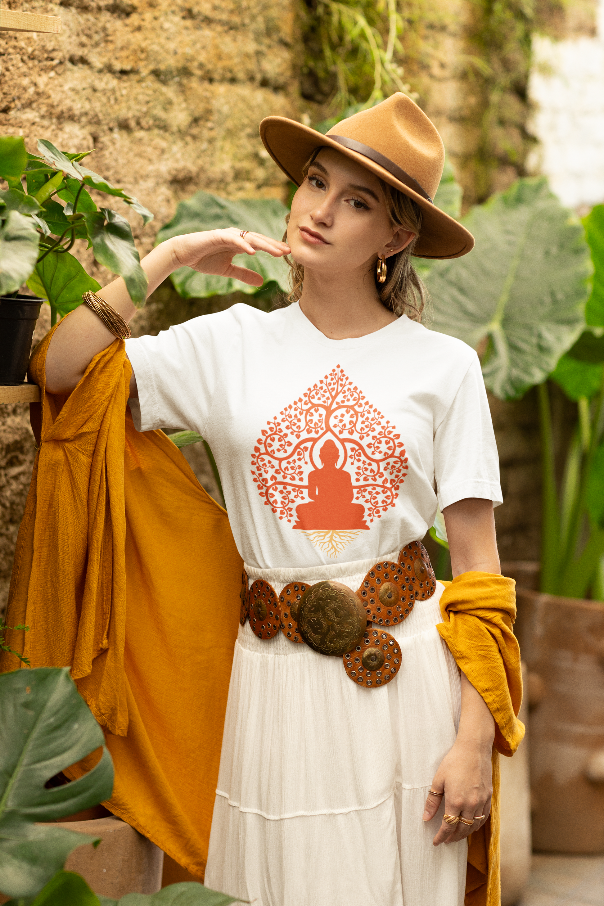 Woman wearing lilmonal spiritual yoga shirt cotton with Buddha design paired with hat and mustard shawl