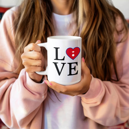 I love Nepal coffee mug with heart-shaped Nepal flag design held by person in pink sweater