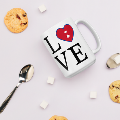 I love Nepal coffee mug with heart design and Nepal flag details surrounded by cookies and spoons
