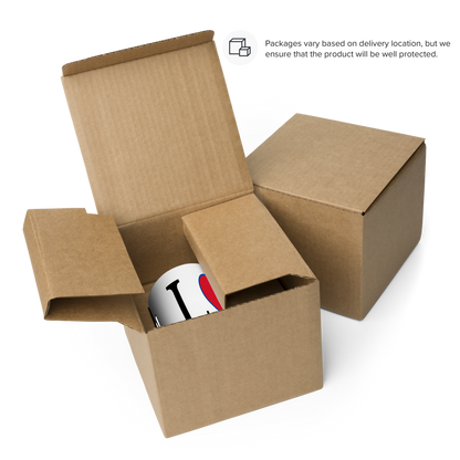 I love Nepal coffee mug partially visible inside open protective brown cardboard shipping box